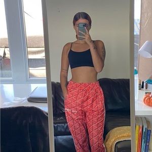 Orange pants in the style of palm angels